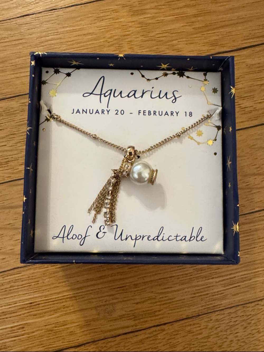 Aquarius gold necklace new in box